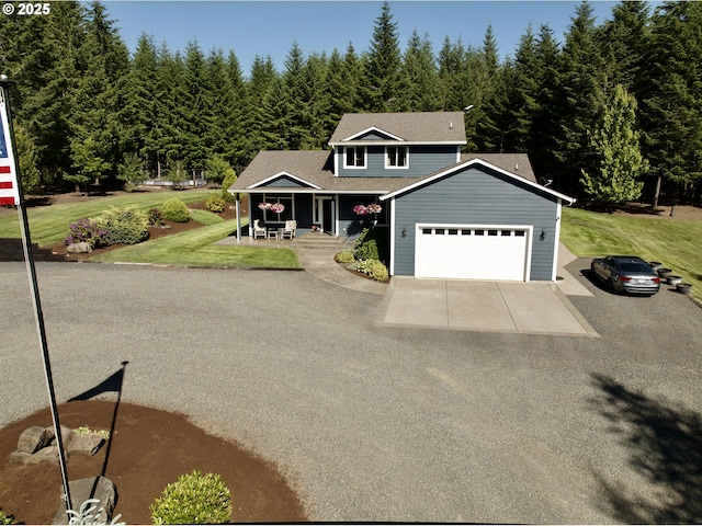 94703 Johnson Rd, Marcola, OR 97454 - traditional home featuring asphalt driveway, an attached garage, covered porch, and a front yard