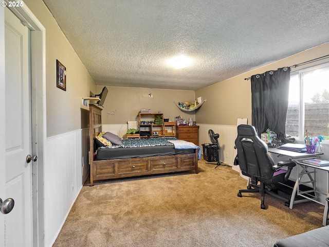 1301 49th Ave, Salem, OR 97317 - bedroom with a textured ceiling, a wainscoted wall, carpet floors, a desk, and wooden walls