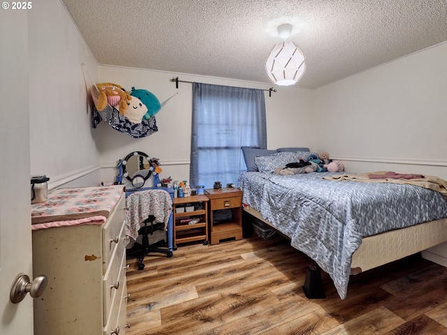 1301 49th Ave, Salem, OR 97317 - bedroom with light wood-type flooring and a textured ceiling