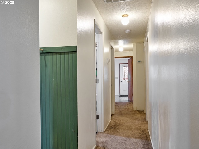 1301 49th Ave, Salem, OR 97317 - hall featuring carpet floors and a textured ceiling