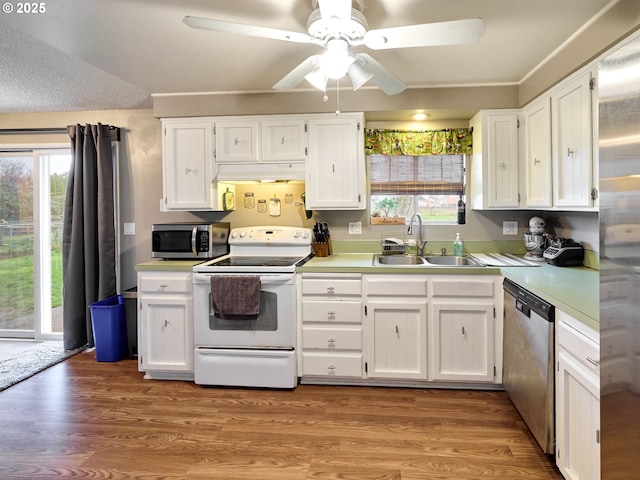 1301 49th Ave, Salem, OR 97317 - kitchen featuring stainless steel appliances, a sink, under cabinet range hood, white cabinets, and light countertops