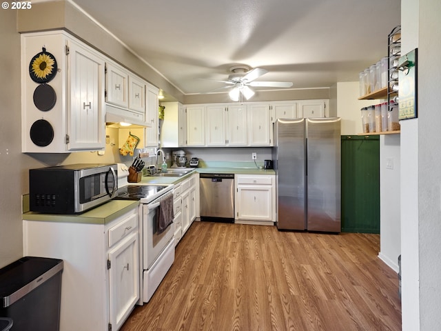 1301 49th Ave, Salem, OR 97317 - kitchen featuring appliances with stainless steel finishes, a sink, ceiling fan, and light wood-type flooring