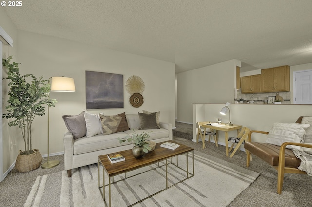 living room with light colored carpet, a textured ceiling, and baseboards