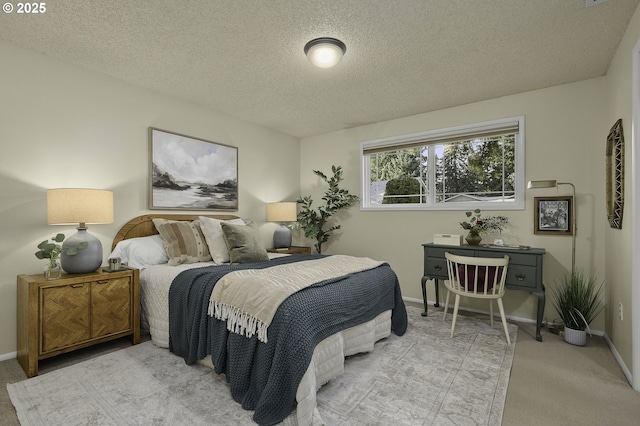 carpeted bedroom featuring a textured ceiling and baseboards