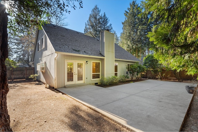 rear view of house with french doors and a patio