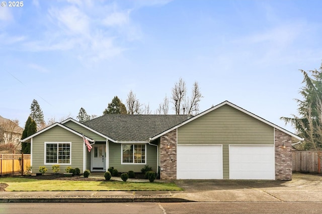 ranch-style house with a garage, brick siding, concrete driveway, fence, and a front yard