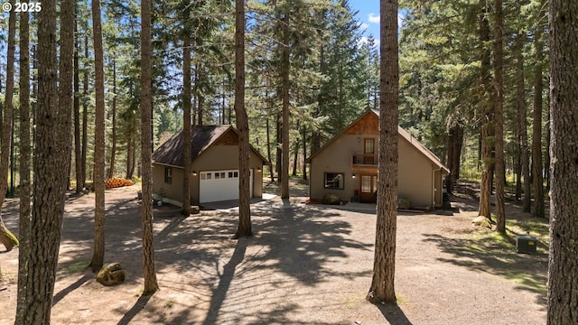 view of front of house featuring an outdoor structure and a garage