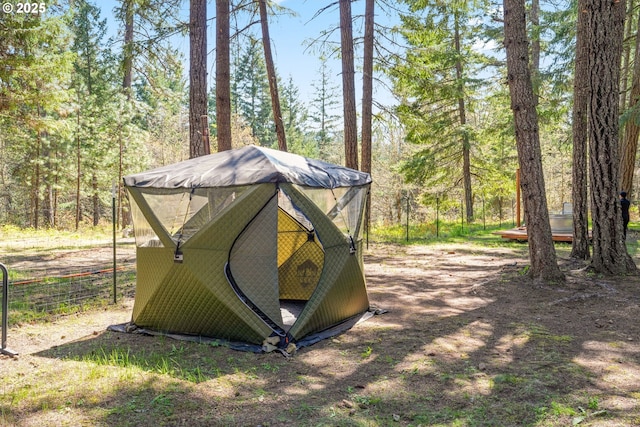 view of outdoor structure with a forest view