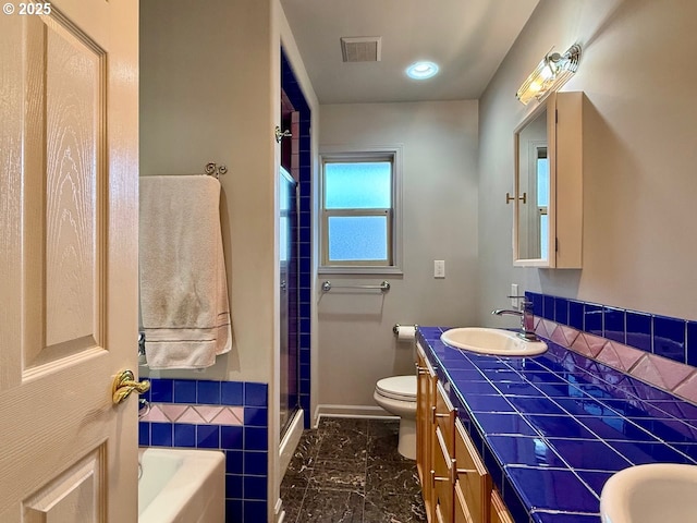 full bath with visible vents, toilet, a stall shower, a washtub, and vanity