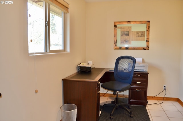 office area featuring baseboards and light tile patterned flooring