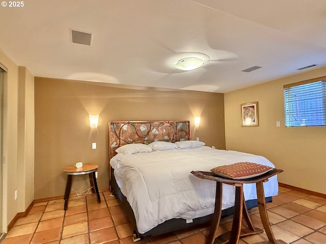 bedroom featuring visible vents and baseboards