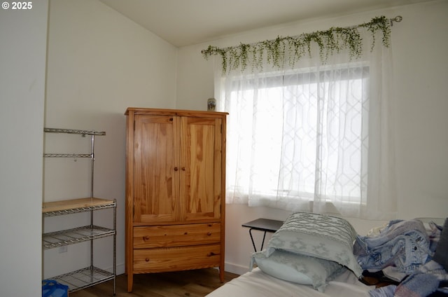 bedroom with wood finished floors