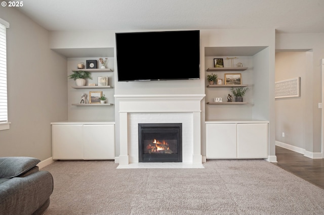 4744 S 19th St, Ridgefield, WA 98642 - living area with a fireplace with flush hearth, carpet, and baseboards