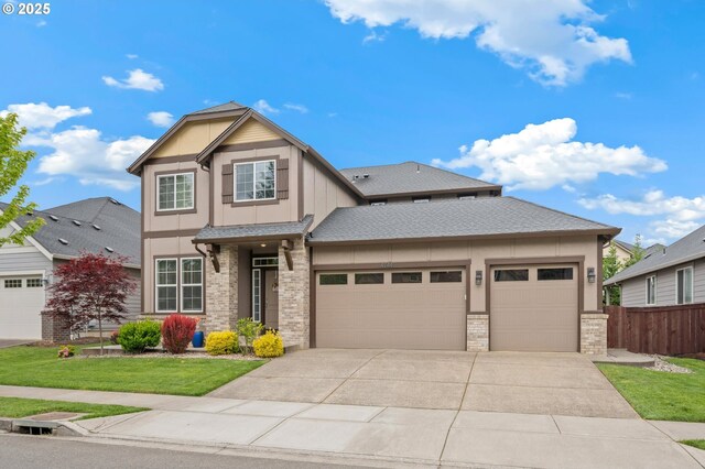 4744 S 19th St, Ridgefield, WA 98642 - view of front of house with concrete driveway, an attached garage, and a shingled roof
