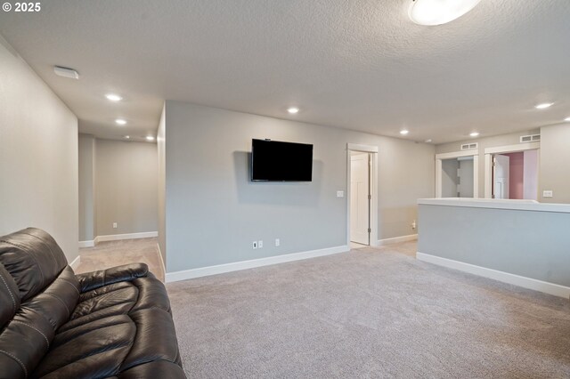 4744 S 19th St, Ridgefield, WA 98642 - living area featuring recessed lighting, light colored carpet, baseboards, and a textured ceiling