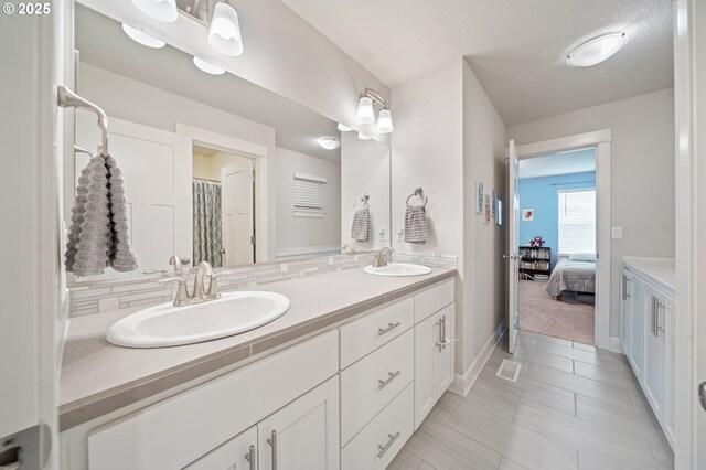 4744 S 19th St, Ridgefield, WA 98642 - bathroom with double vanity, baseboards, and tile patterned floors