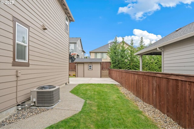 4744 S 19th St, Ridgefield, WA 98642 - view of yard featuring an outdoor structure, central AC, and a patio area