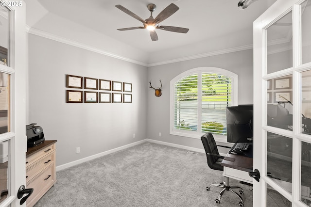 office area with a ceiling fan, baseboards, light colored carpet, and ornamental molding