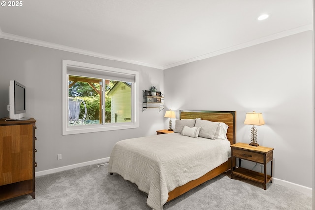 bedroom featuring baseboards, ornamental molding, and carpet floors