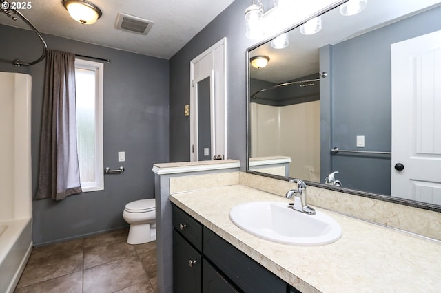 full bathroom featuring tile patterned floors, shower / washtub combination, vanity, and toilet