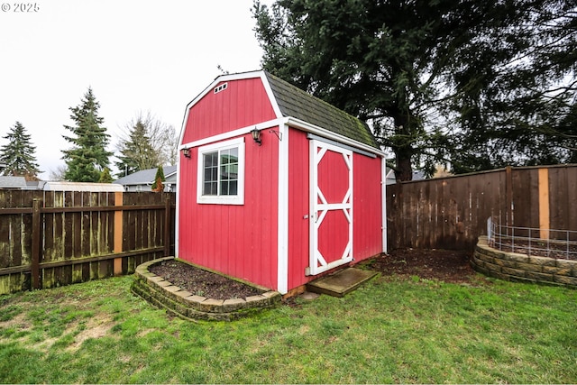 view of outdoor structure with a lawn