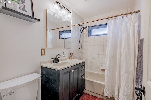 full bath with vanity, shower / bath combo, and toilet