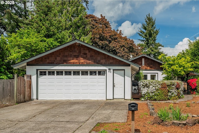 single story home featuring fence, a shingled roof, driveway, and a chimney