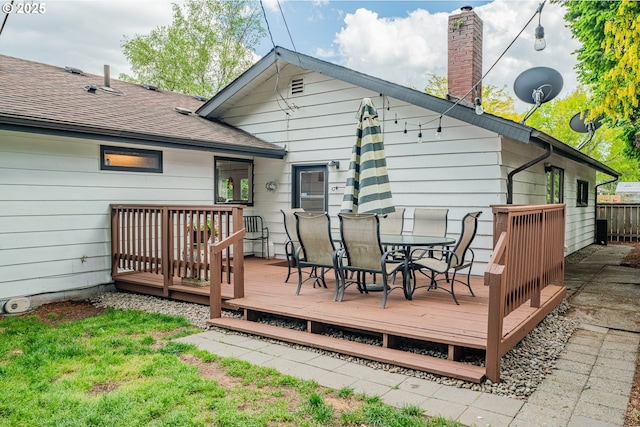 wooden deck with outdoor dining area
