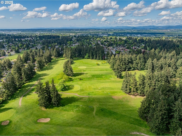 birds eye view of property featuring view of golf course and a mountain view