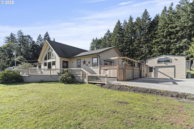 view of front facade with a garage, an outdoor structure, a deck, and a front yard