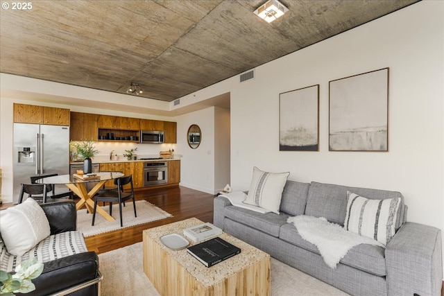 1926 W Burnside St Unit 301, Portland, OR 97209 - living room featuring dark wood-type flooring and baseboards