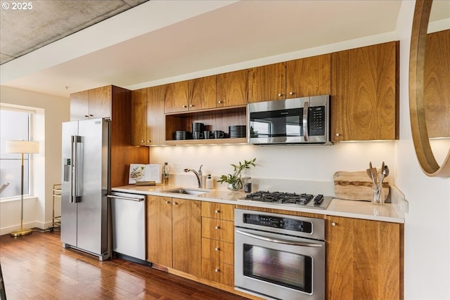 1926 W Burnside St Unit 301, Portland, OR 97209 - kitchen featuring stainless steel appliances, brown cabinets, and light countertops