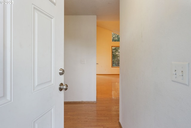 corridor featuring light hardwood / wood-style floors