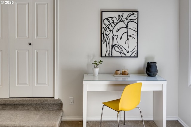 home office with carpet floors and baseboards