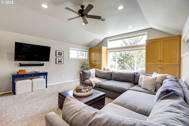 living room featuring visible vents, carpet floors, baseboards, ceiling fan, and vaulted ceiling