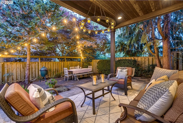 view of patio / terrace with a fenced backyard, an outdoor hangout area, and outdoor dining space