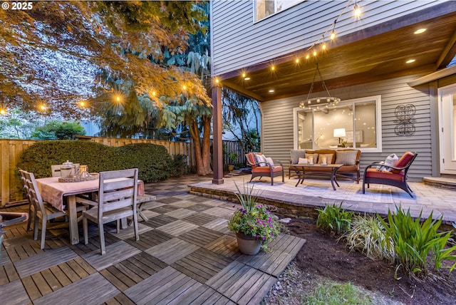 view of patio featuring outdoor dining area, a fenced backyard, and an outdoor hangout area