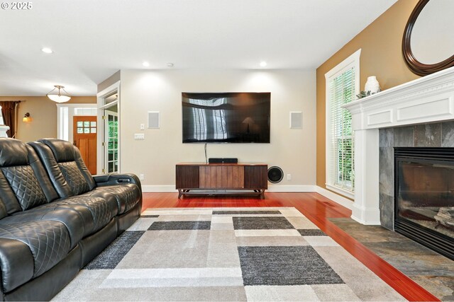 20817 NE 101st Ct, Battle Ground, WA 98604 - living room featuring wood finished floors, recessed lighting, and a tile fireplace