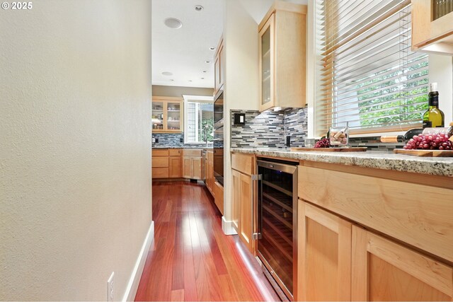 20817 NE 101st Ct, Battle Ground, WA 98604 - kitchen with wine cooler, light brown cabinetry, backsplash, dark wood-style flooring, and a textured wall