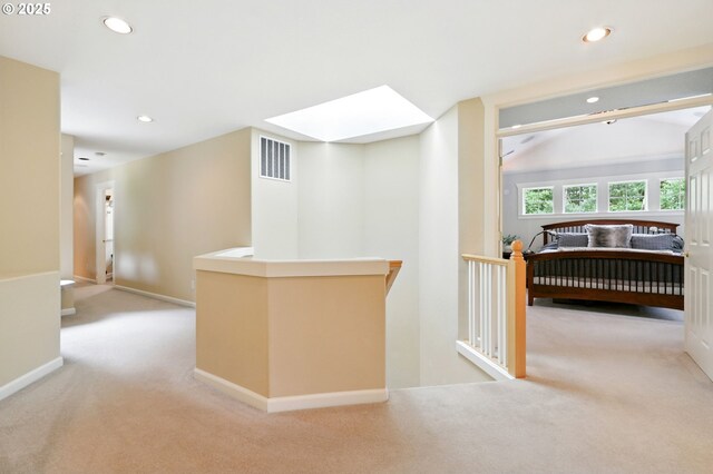20817 NE 101st Ct, Battle Ground, WA 98604 - hallway with carpet flooring, a skylight, recessed lighting, and an upstairs landing