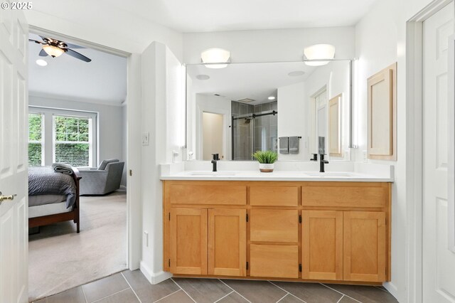 20817 NE 101st Ct, Battle Ground, WA 98604 - ensuite bathroom featuring a stall shower, double vanity, tile patterned flooring, and a ceiling fan