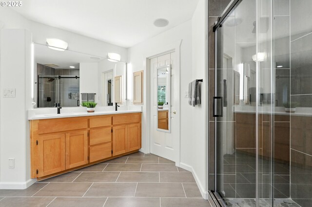 20817 NE 101st Ct, Battle Ground, WA 98604 - bathroom with double vanity, a shower stall, and tile patterned floors