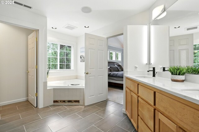 20817 NE 101st Ct, Battle Ground, WA 98604 - full bathroom with a bath, plenty of natural light, double vanity, ensuite bathroom, and recessed lighting