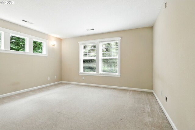 20817 NE 101st Ct, Battle Ground, WA 98604 - empty room with light carpet and healthy amount of natural light