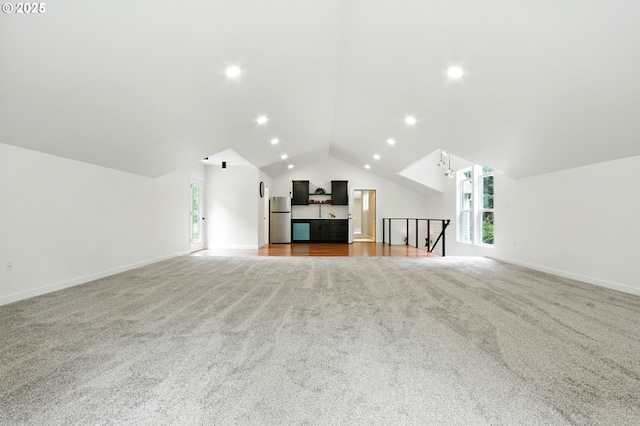 20817 NE 101st Ct, Battle Ground, WA 98604 - unfurnished living room with light carpet, vaulted ceiling, and recessed lighting