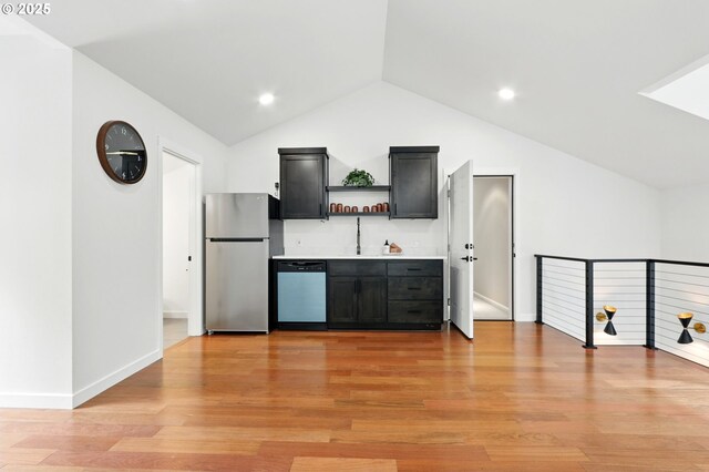 20817 NE 101st Ct, Battle Ground, WA 98604 - kitchen featuring freestanding refrigerator, dishwasher, open shelves, vaulted ceiling, and dark cabinets