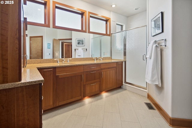 17514 Brookhurst Dr, Lake Oswego, OR 97034 - full bath with double vanity, a stall shower, baseboards, and recessed lighting