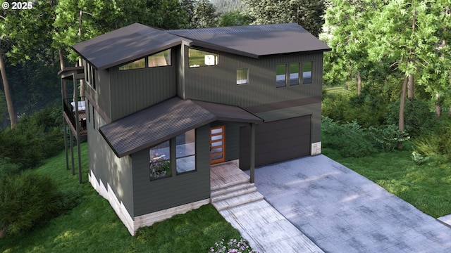 3105 NW Blue Sky Ln, Portland, OR 97229 - view of front of house with a garage, driveway, a front lawn, and metal roof