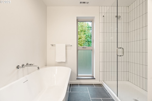 3105 NW Blue Sky Ln, Portland, OR 97229 - bathroom with visible vents, tile patterned floors, a freestanding tub, and a stall shower