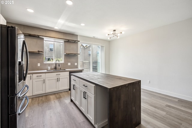 5958 SE 16th Loop, Gresham, OR 97080 - kitchen featuring stainless steel fridge, a sink, open shelves, light wood-style flooring, and recessed lighting